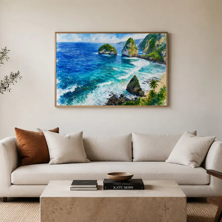 A watercolour of a tropical coastline with rock islands, framed above a linen sofa