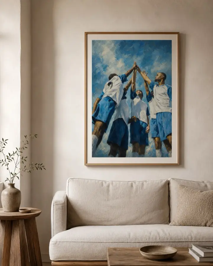 An oil painting of footballers celebrating together, framed above a sofa